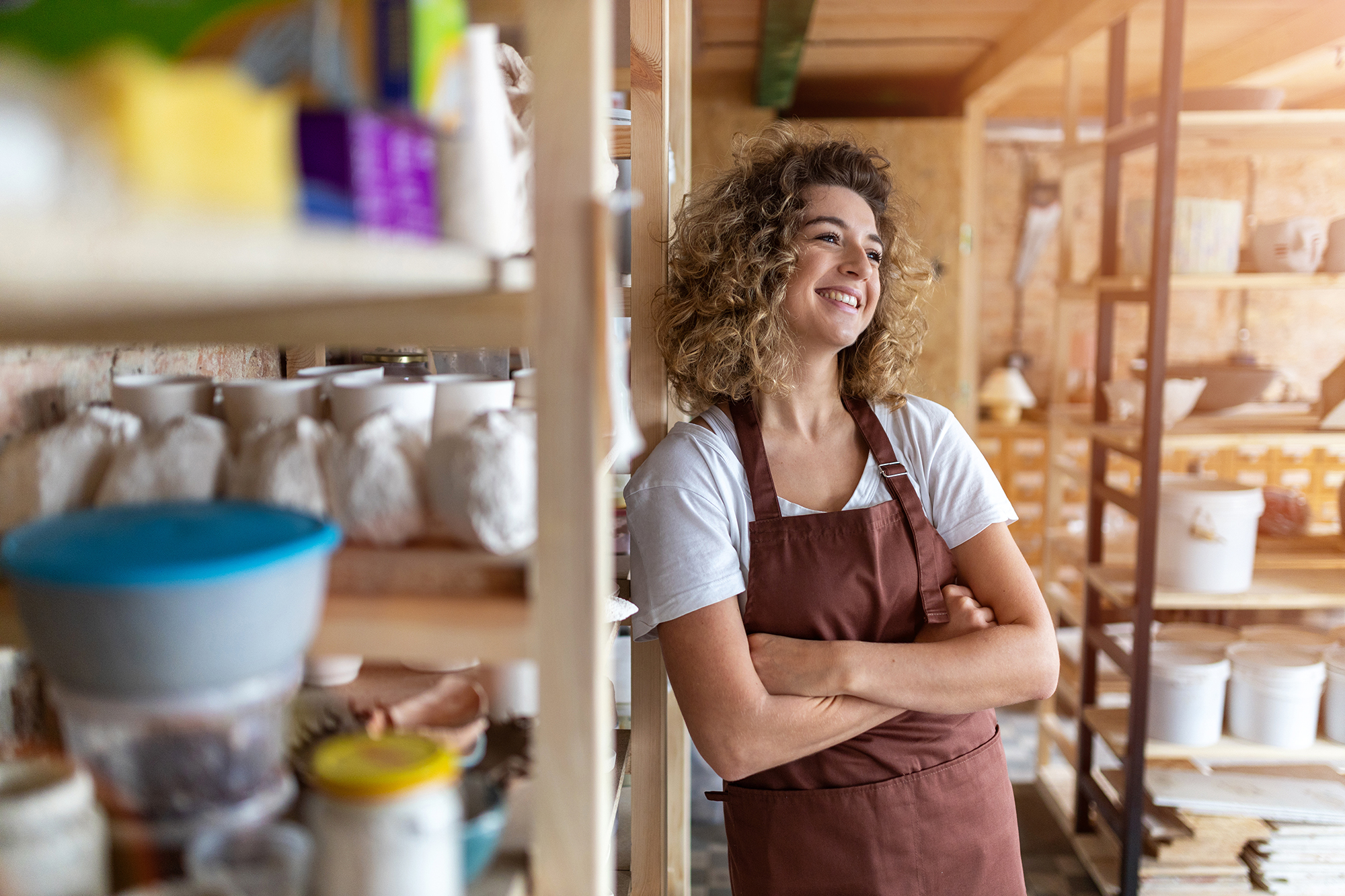 Portrait of woman pottery artist in art studio